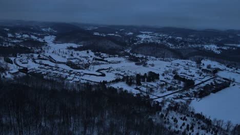 aerial view of snowy residential area at night