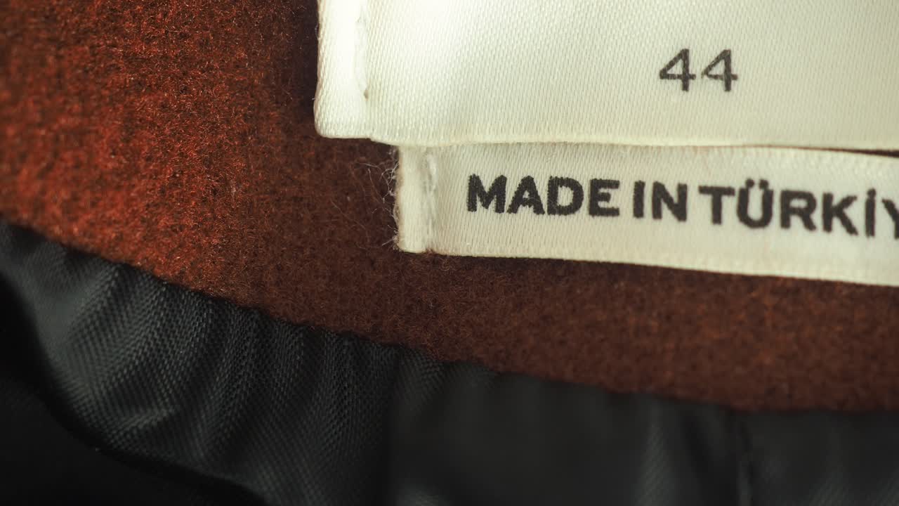 Close-up of a clothing label showing 'Made in Türkiye' and size 44