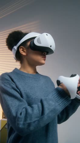 woman using vr headset and controllers