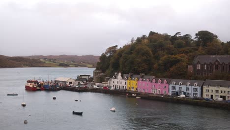 colorful row homes along the seaside harbor in the village of portree on the isle of skye in the highlands of scotland