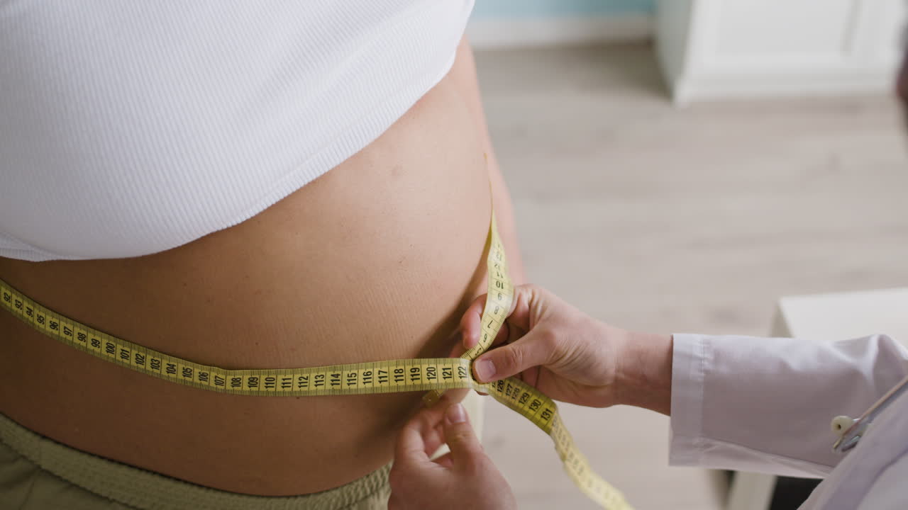 Pregnant woman being examined by doctor