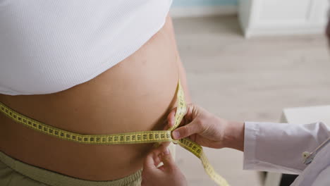 pregnant woman being examined by doctor