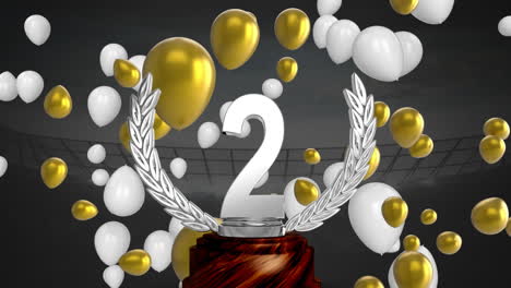trofeo del segundo lugar y globos en un estadio deportivo