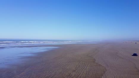 The-beautiful-wide,-open-beach-of-Washington,-perfect-for-an-ocean-drive---aerial