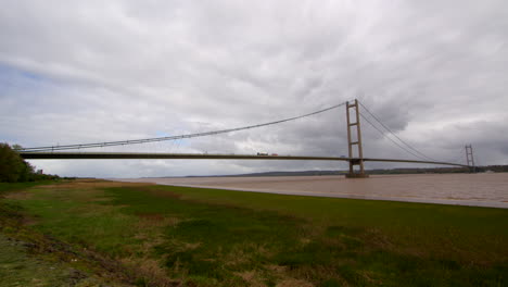 wide shots of the humber bridge by water side road