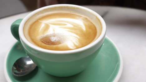 close-up of a cup of latte with latte art