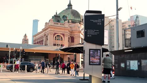 people walking and gathering near historic station