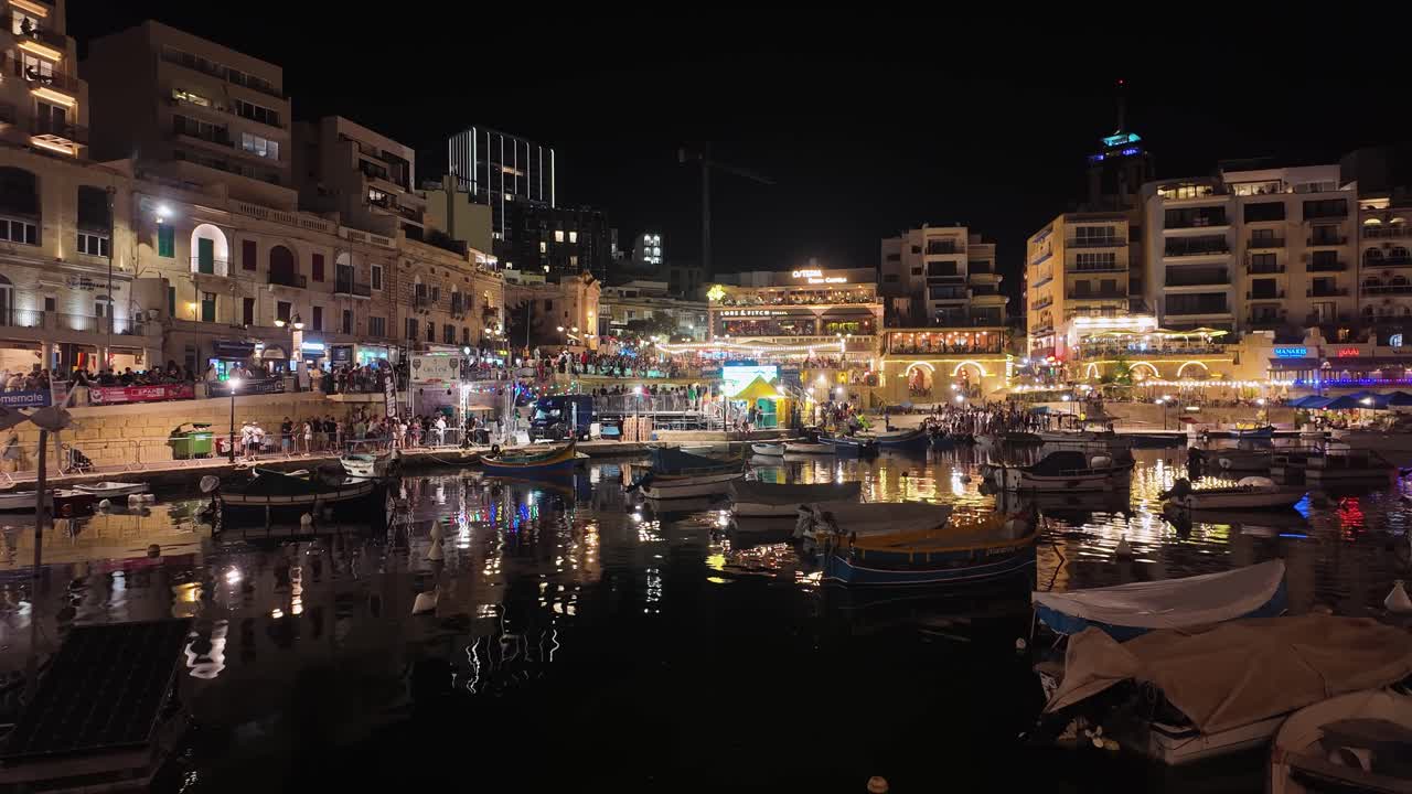 Vibrant night scene of a bustling harbor with illuminated buildings and boats reflecting on the water