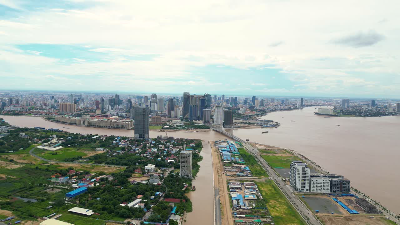 Aerial view of Phnom Penh cityscape with rivers and bridges