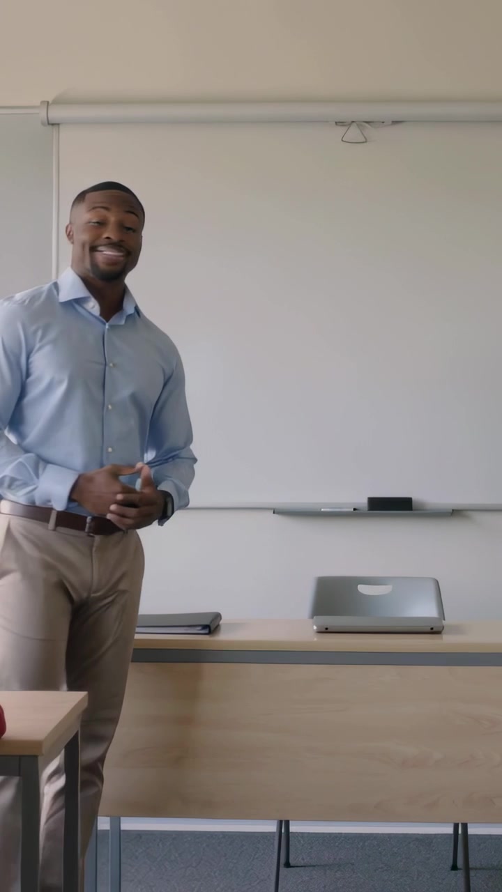 Vertical video: Moving from left teacher in blue shirt stepping to whiteboard with marker, teaching