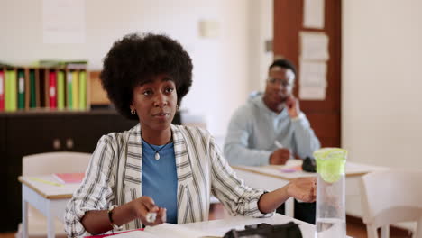 University,-woman-with-question-in-classroom