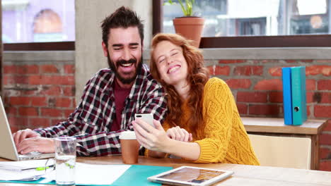 Casual-business-team-working-together-at-desk