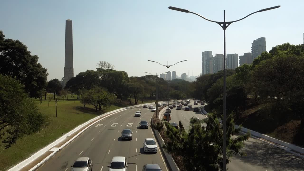 light traffic on '23 de Maio Avenue', important freeway of Sao Paulo city. Monument obelisk on the back