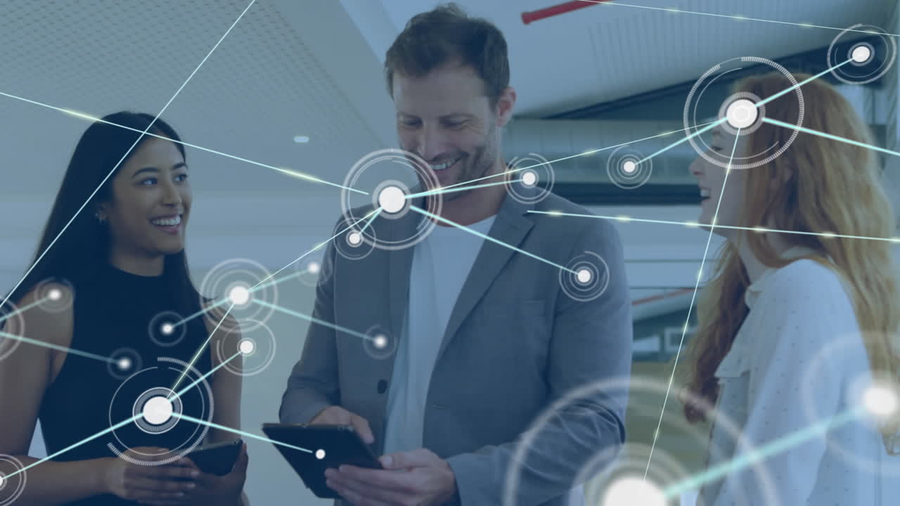 Animation of network of connections over diverse business people using tablet at office