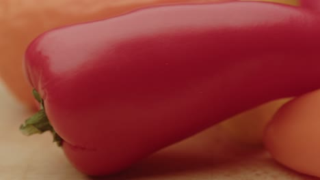 macro dolly of old bell peppers on a wooden surface