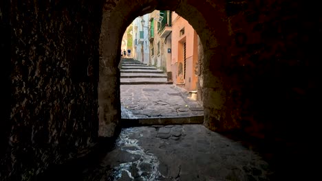stone path through archway in sorrento, italy