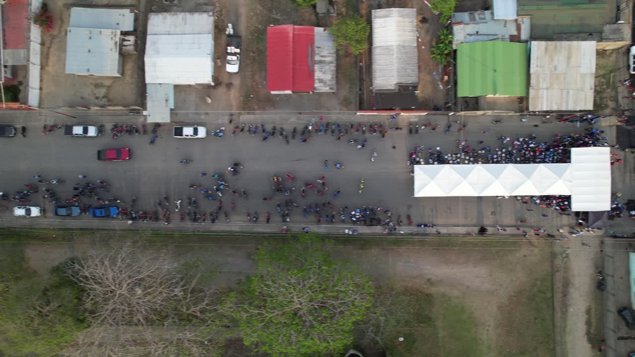 People gathered on a street in guanarito, portuguesa, venezuela, aerial view