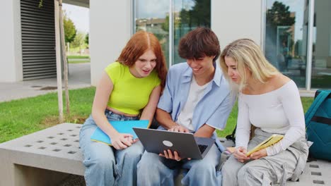 students learning together with a laptop