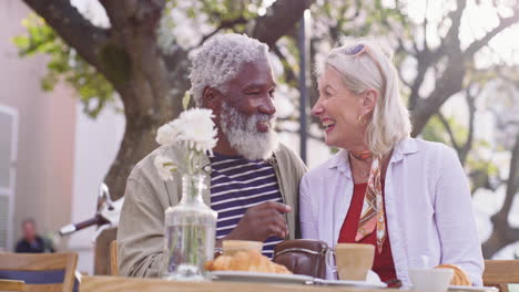 elderly couple at an outdoor cafe