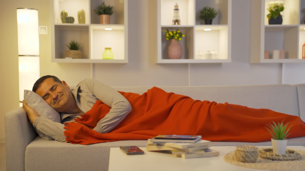 Man smiling while sleeping.