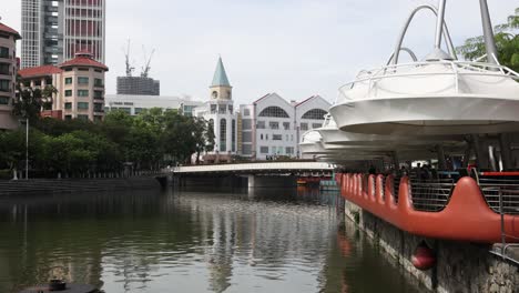 singapore riverfront with restaurants and bridge