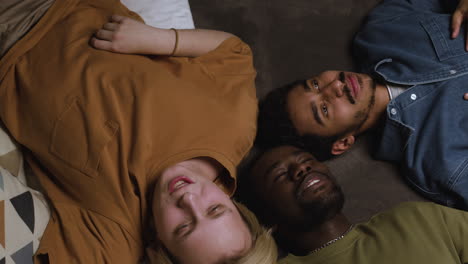 group of men laying on the bed