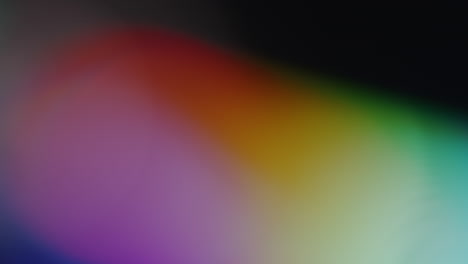 Multicolored-light-leaks-4k-footage-on-black-background,-lens-studio-flare-leak-burst-overlays