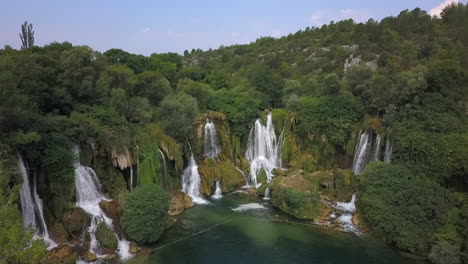 aerial descends to beautiful kravice falls waterfall, studenci bosnia