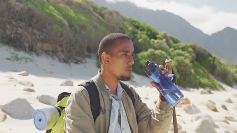 sporty mixed race man with prosthetic leg hiking