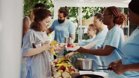 the poor receiving food from volunteers