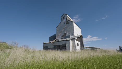 old grain elevator in a field