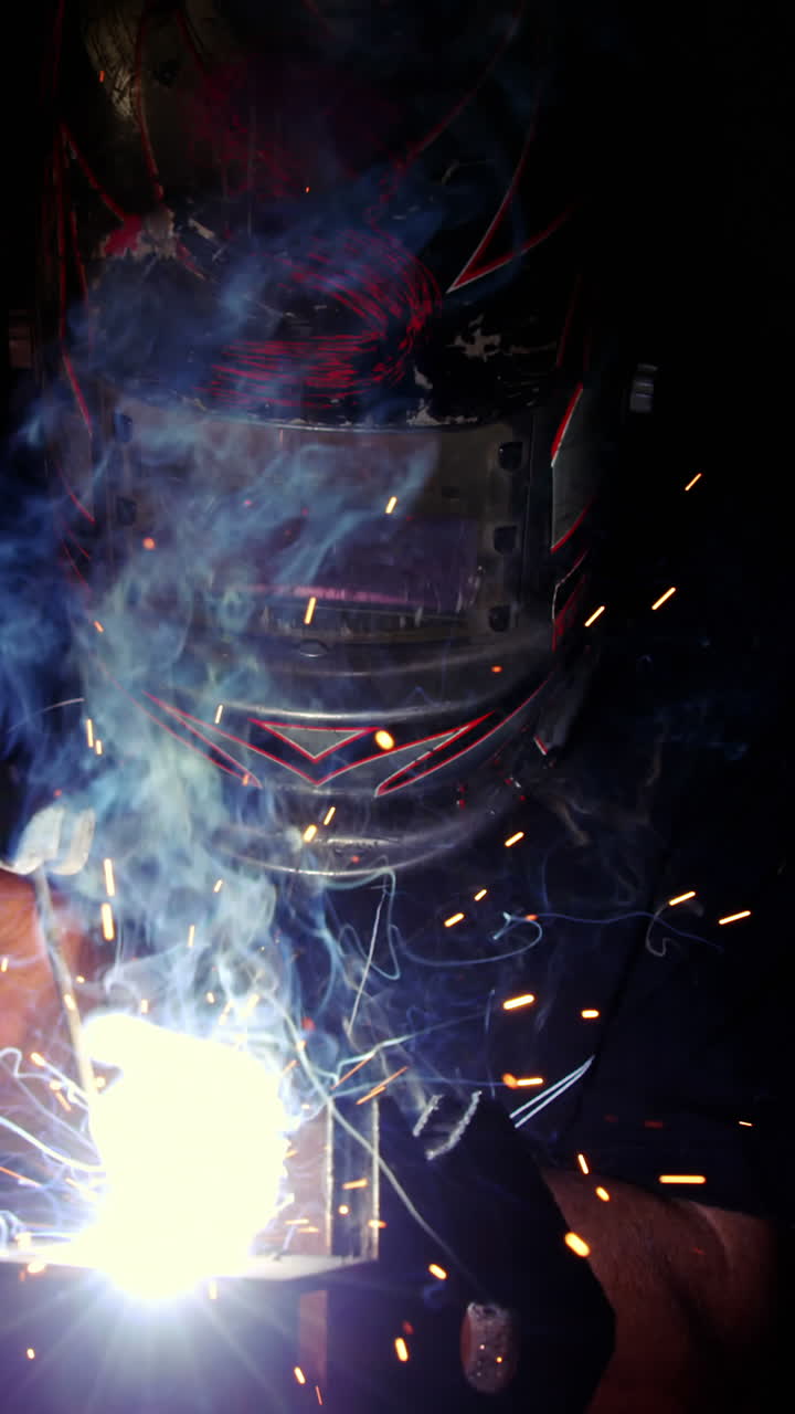 Welder working on a piece of metal