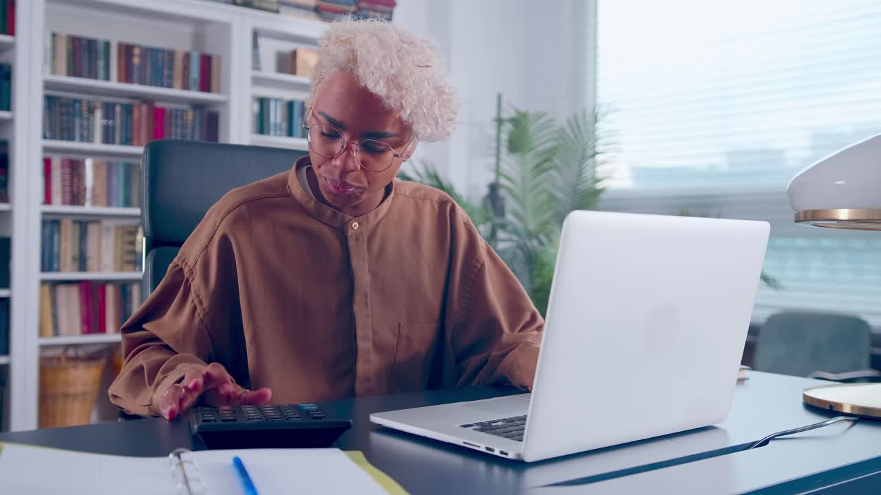 Unhappy woman calculating expenditures or taxes feeling stressed of mistakes