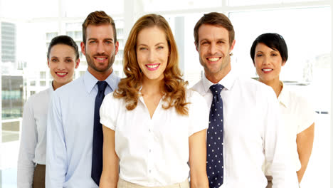 business team giving thumbs to camera