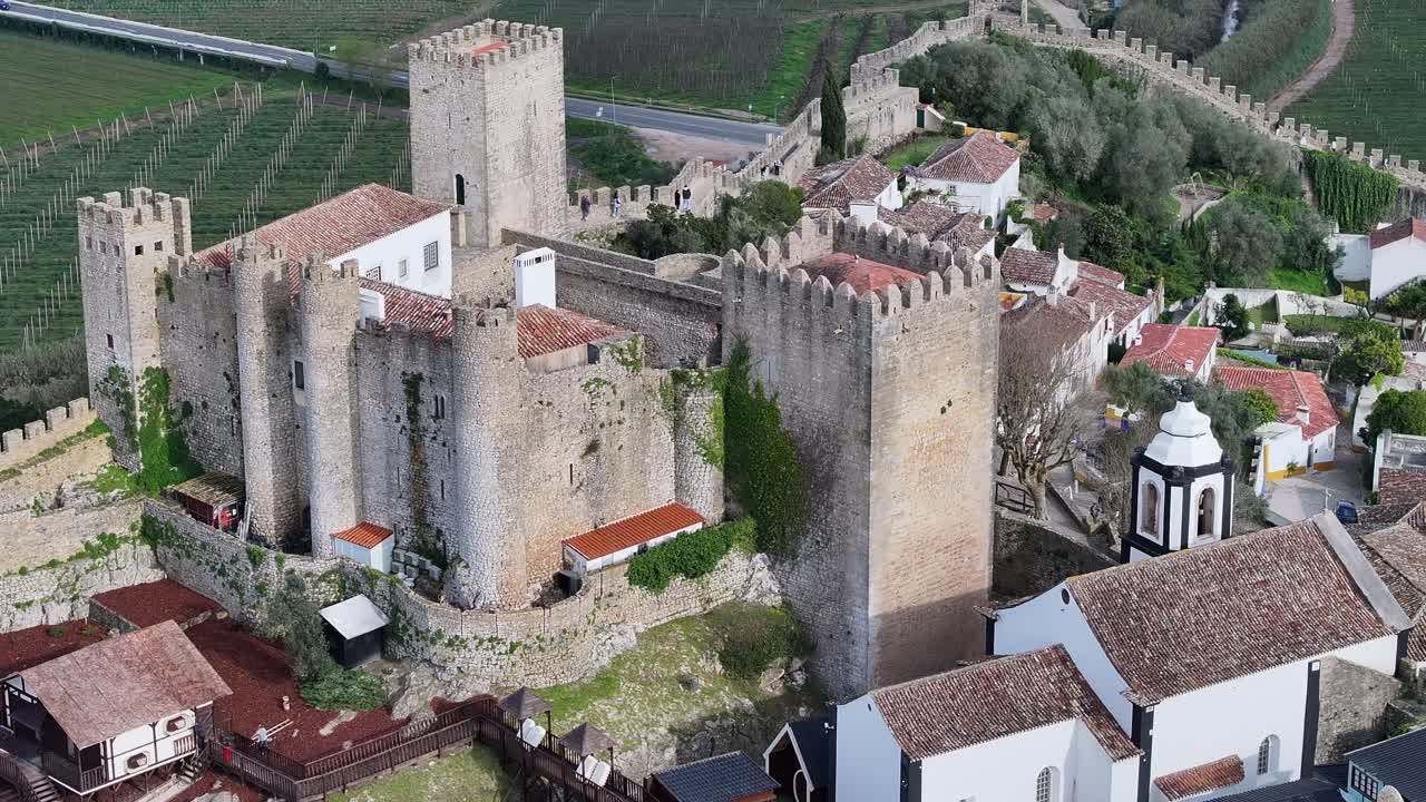 Obidos Castle At Obidos In District Of Leiria Portugal. Historic City Scenery. Medieval Architecture. Walls Of Castle Construction. Obidos Castle At Obidos In District Of Leiria Portugal. Old Village