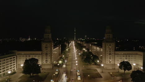 Aerial-View-of-Empty-Karl-Marx-Allee-Street-at-Night-towards-Alexanderplatz-TV-Tower-in-Berlin,-Germany-during-COVID-19-Coronavirus-Pandemic