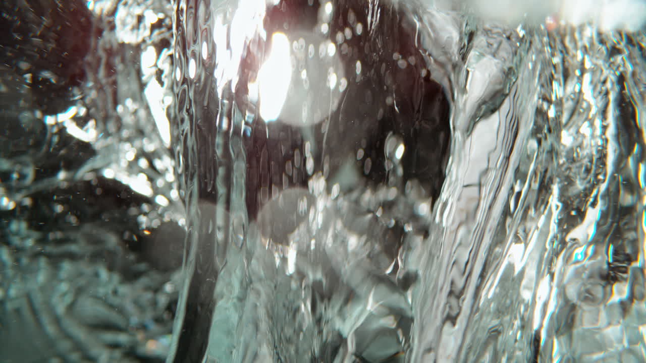 Ice Cubes Splashing in Water