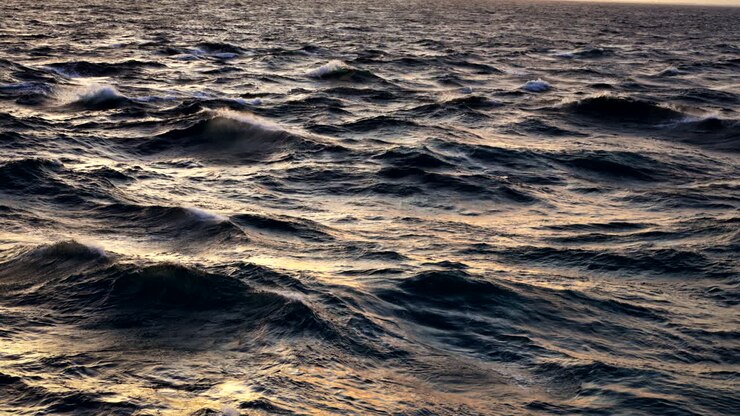 Onde Astratte Dell'Oceano Al Tramonto