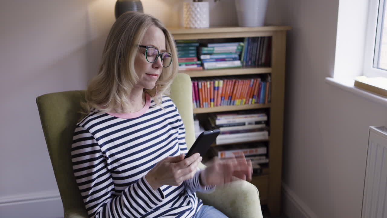 Woman sitting in armchair