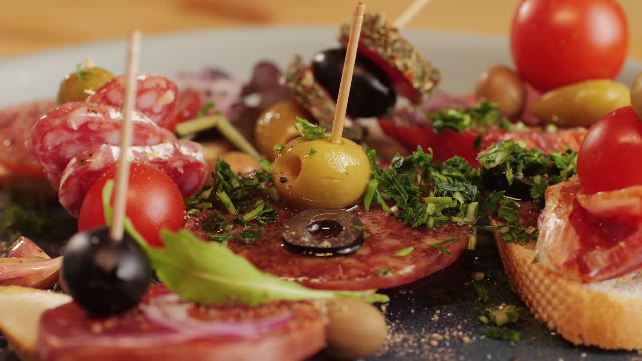 Mix of spanish pork sausages, Cutting board of appetizing catalonian snack - fuet, jamon, chorizo, olives, supermarket tapas food in spain, traditional cuisine.