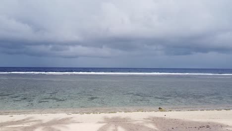 Ocean-landscape-with-palm-tree-drone-reveal-in-Philippines