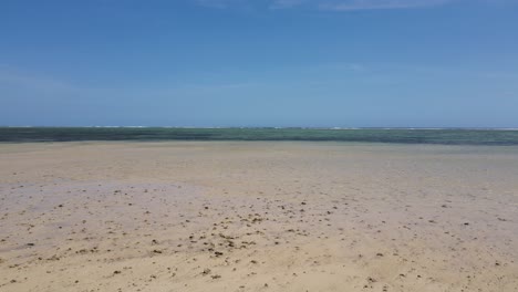 Endless-sandy-beach-in-tropical-Ocean