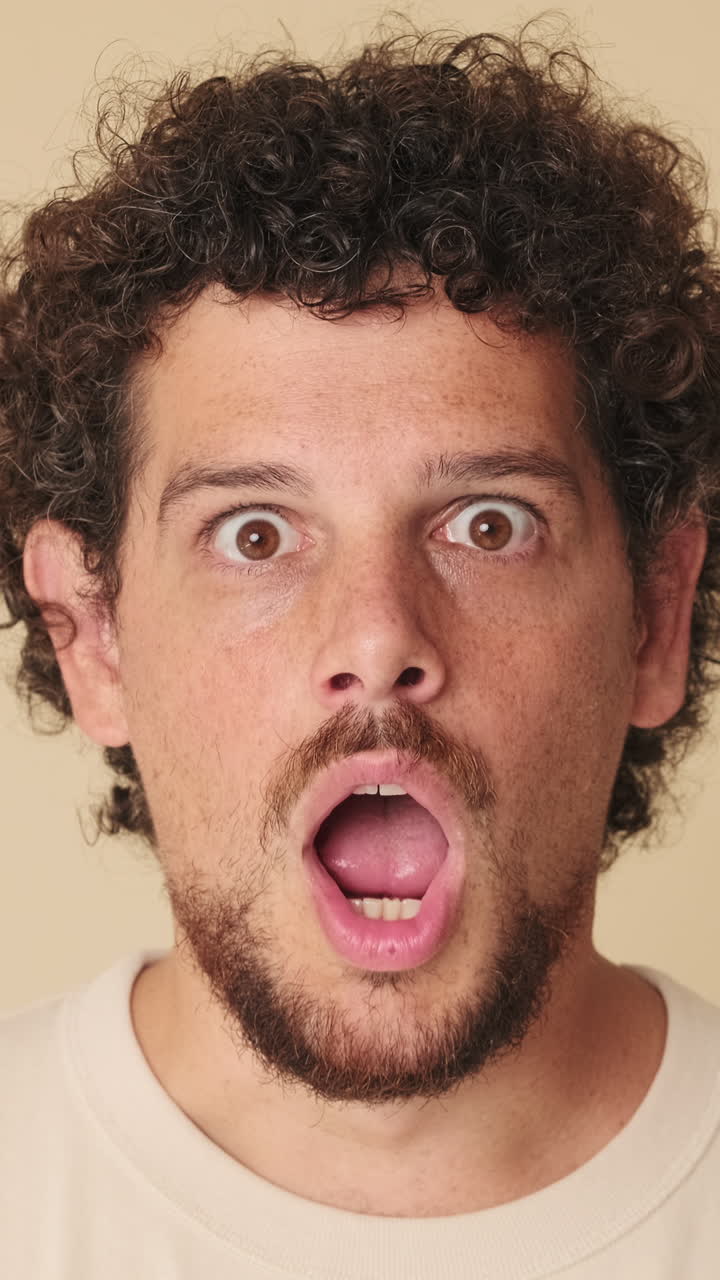 Close-up of Man's Face Reacting with Surprise and Shock