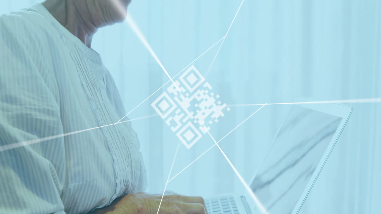 QR code animation over person typing on laptop in bright room