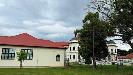 one-storied building with a red roof. ensemble of a historical buildings in the nature surrounding