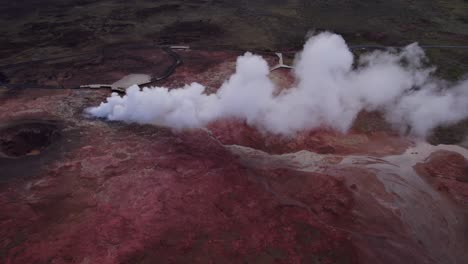 thermal steam vent flowing in red volcanic lava field of gunnuhver