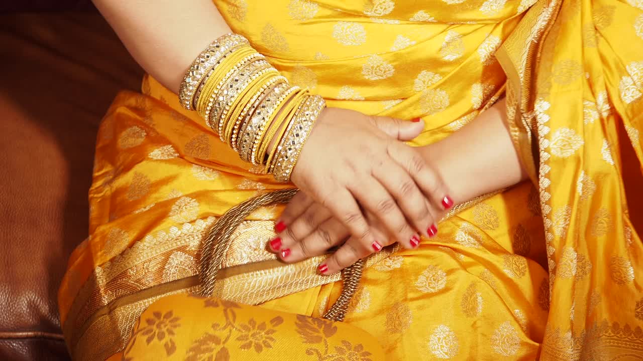 Woman in Yellow Sari with Bangles