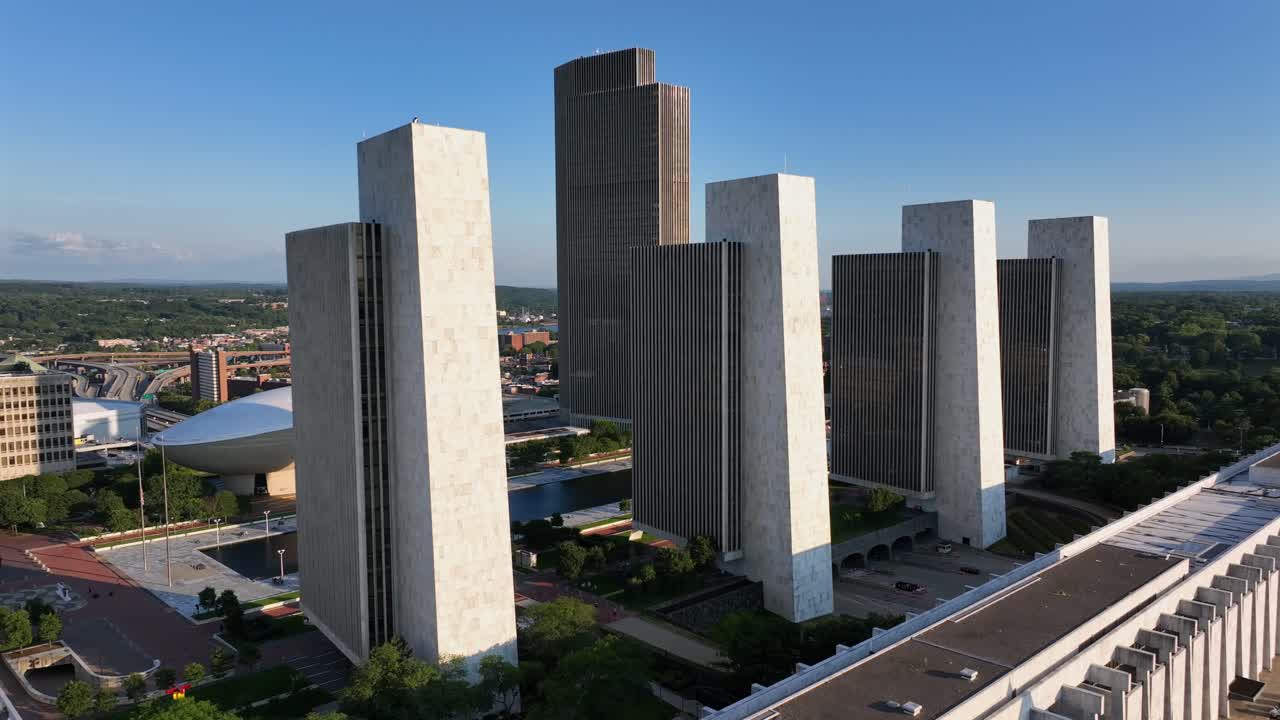 Four modern towers of Agency Building office at Empire State Plaza in Albany. Sunny day with blue sky. Aerial wide shot