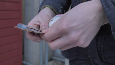 close up of white hands that count euros stack of cash