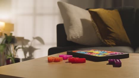 coloured interlocking shape puzzle on table at home for child diagnosed with asd 7